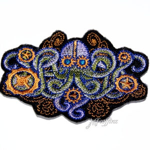 May include: Embroidered patch featuring a steampunk octopus design. The patch has a black border with a detailed octopus in blue, green, and gold. The octopus has gear-like accents and is set against a white background. The text "MTcoffinz" is at the bottom.