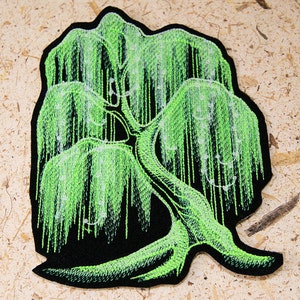 May include: Green embroidered patch of a weeping willow tree with a black background.