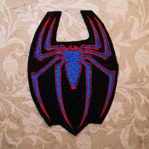 May include: Black spider web patch with red and blue stitching. The spider is in the center of the web and has a blue body.