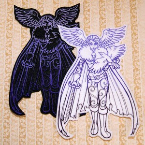 May include: Two embroidered patches, one black with purple stitching and one white with purple stitching, depicting a winged figure holding a sword and a bird.
