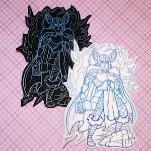 May include: Two embroidered patches featuring a stylized image of a warrior with a helmet, cape, and holding a hammer. One patch is black with blue stitching, the other is white with blue stitching.