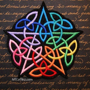 May include: A rainbow colored Celtic knot design embroidered on a black fabric patch. The knot is in the shape of a star.