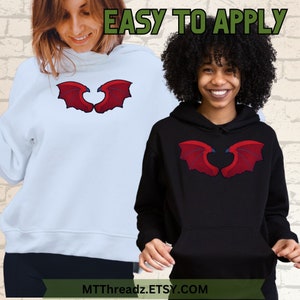 Puede incluir: Dos sudaderas con capucha con un dise&ntilde;o de alas de drag&oacute;n rojo en forma de coraz&oacute;n. El texto "EASY TO APPLY" est&aacute; en la parte superior de la imagen. El texto "MTTThreadz.ETSY.COM" est&aacute; en la parte inferior de la imagen.