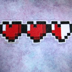 May include: A red, black, and white embroidered patch with three pixelated hearts. The hearts are in a row and the patch is on a purple background.