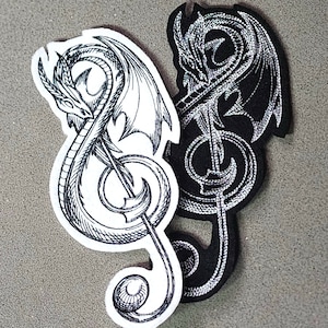 May include: Two black and white embroidered patches of a treble clef with a dragon wrapped around it. The dragon on the left is white and the dragon on the right is black.