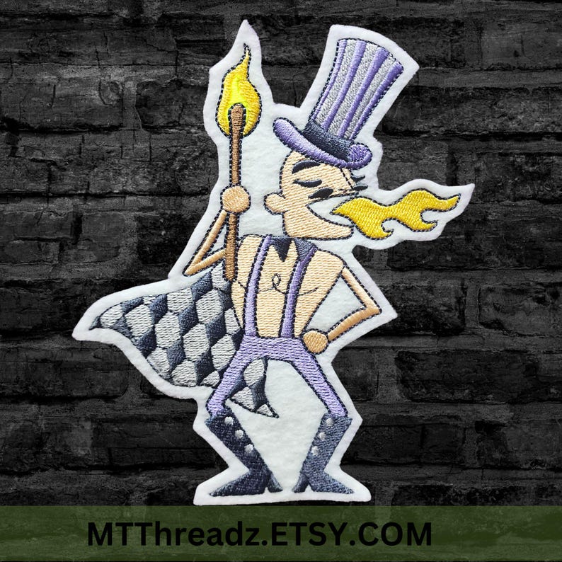 May include: Embroidered patch featuring a cartoon character wearing a purple top hat and holding a flaming torch. The character is wearing a purple and white checkered cape and has a yellow flame coming out of their mouth. The patch is on a white background.