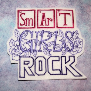 May include: Purple embroidered patch with the text "SMART GIRLS ROCK" with a floral design and the chemical symbols for Samarium, Argon, and Technetium.
