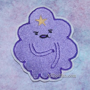 May include: Purple embroidered patch of a cartoon character with a star on its head and a frowning expression. The character is shaped like a cloud and has a white outline. The text "MTcoffinz.com" is in the bottom right corner.