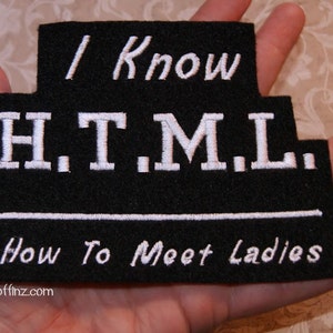 May include: Black felt patch with white embroidered text that reads "I Know H.T.M.L. How To Meet Ladies" and the website "MTCoffinz.com".