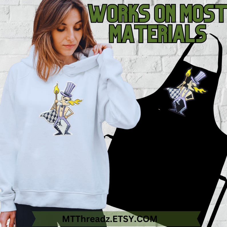 May include: A light blue hooded sweatshirt with a cartoon character wearing a top hat and holding a torch. The character is printed on the front of the sweatshirt. The text "WORKS ON MOST MATERIALS" is printed in green letters on a white brick wall background. The text "MTTThreadz.ETSY.COM" is printed at the bottom of the image.