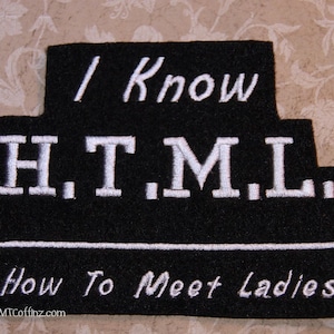 May include: Black felt patch with white embroidery that reads "I Know H.T.M.L. How To Meet Ladies" and the website "MTCoffinz.com".