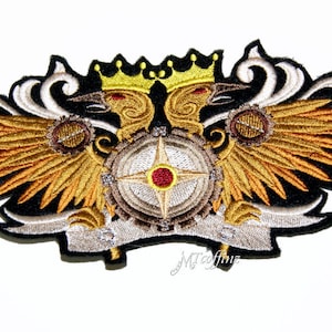 May include: Embroidered patch featuring two golden crowned eagles with wings spread, holding a circular gear with a red star in the center. The patch has a black background and a white banner with the text "MTcoffinz".