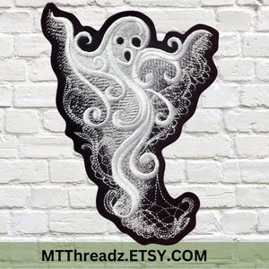 May include: White embroidered ghost with black outline and intricate swirling details. The ghost is in a spooky pose with its arms raised.