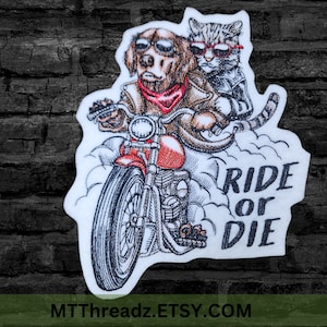 May include: Embroidered patch featuring a dog and cat riding a red motorcycle, both wearing sunglasses and leather jackets. The patch includes the text "RIDE OR DIE" in black, with the Etsy shop URL at the bottom.