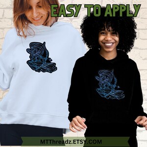 May include: Two people wearing hoodies with a blue and black graphic design of a person holding a bow and arrow. The text "EASY TO APPLY" is at the top of the image. The text "MTTThreadz.ETSY.COM" is at the bottom of the image.