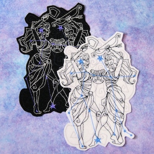 May include: Two embroidered patches depicting the Gemini constellation. One patch is black with white stitching, the other is white with black stitching. Both patches feature two figures holding a lyre and an arrow.