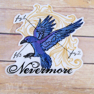 May include: Embroidered patch featuring a purple raven in flight with gold filigree and the text "Nevermore".