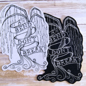 May include: Two embroidered patches, one white and one black, featuring a weeping willow tree design and the text "Bend Don't Break".