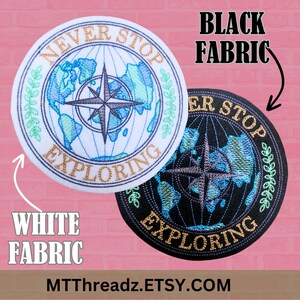 May include: Two embroidered patches with a compass and globe design. The text "Never Stop Exploring" is around the globe. One patch is on white fabric and the other is on black fabric.