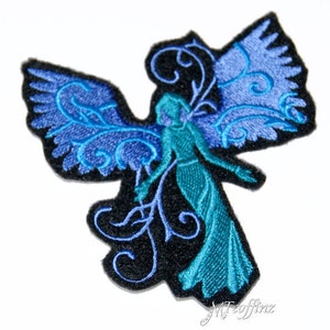 May include: An embroidered iron-on patch featuring a blue and teal angel with wings and floral details. The angel is surrounded by a black background.