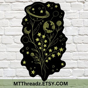 May include: A black embroidered patch with a yellow floral design featuring stars, planets, and moons. The patch has a distressed, vintage look and includes the text "MTTThreadz.ETSY.COM".