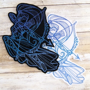 May include: Two embroidered patches of a female archer with a bow and arrow. One patch is black with blue embroidery, the other is white with blue embroidery.