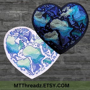 May include: Two heart-shaped embroidered patches. One is white with a blue and green Earth design. The other is black with a blue and green Earth design. The patches are on a gray brick background. The text "MTThreadz.ETSY.COM" is at the bottom.