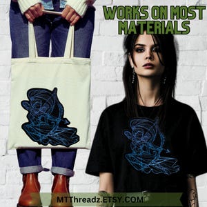 May include: A tote bag and a black t-shirt both feature a blue and black embroidered design of an archer with an arrow. The text "WORKS ON MOST MATERIALS" is displayed above the image. The text "MTTthreadz.ETSY.COM" is displayed below the image.