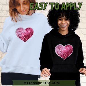 May include: Two people wearing hoodies with a pink and white heart design embroidered on the front. The text "EASY TO APPLY" is at the top of the image. The text "MTTThreadz.ETSY.COM" is at the bottom of the image.
