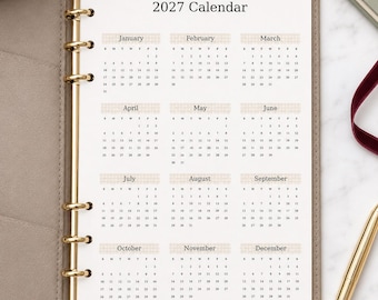Agenda personale 2027 con dashboard, inserto calendario annuale, pagina agenda minimalista neutra, ricarica agenda a 6 anelli