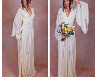 ivory pure silk bohemian wedding dress. Bell ANGEL SLEEVES. elegant boho wedding gown. POCKETS. empire waist. lace trim. deep v neckline.