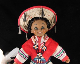 Doll in the red dress in Spanish costume