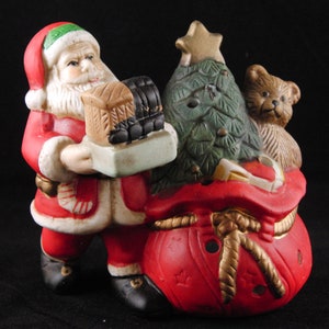 Porcelain candle holder Santa Claus and toys