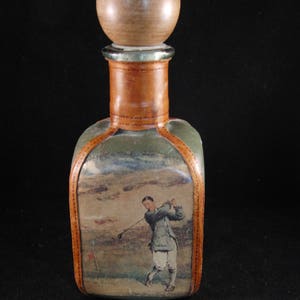 Brown and green bottle covered in leather