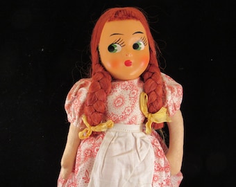 Doll in the red and white dress