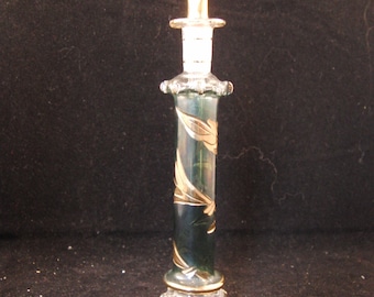 Vintage green glass perfume bottle