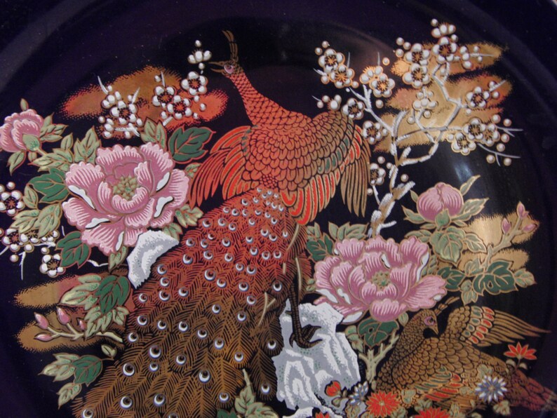 Vintage blue plate with peacock