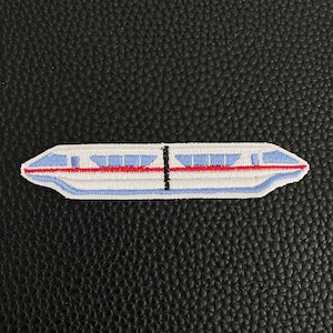 May include: A white and blue embroidered patch of a monorail train with red accents.