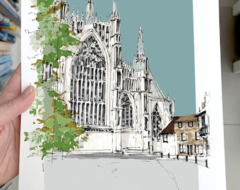 May include: A black and white sketch of York Minster, a large cathedral with tall spires and intricate details. The sketch is set against a light blue background with a green tree in the foreground. The text "YORK MINSTER" is written at the top of the image, and the text "17th SEPTEMBER 2022 Verity and Owen" is written at the bottom.