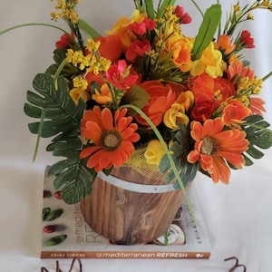 Artificial Flowers in a Wood Bucket. floral Arrangement, Spring Arrangement