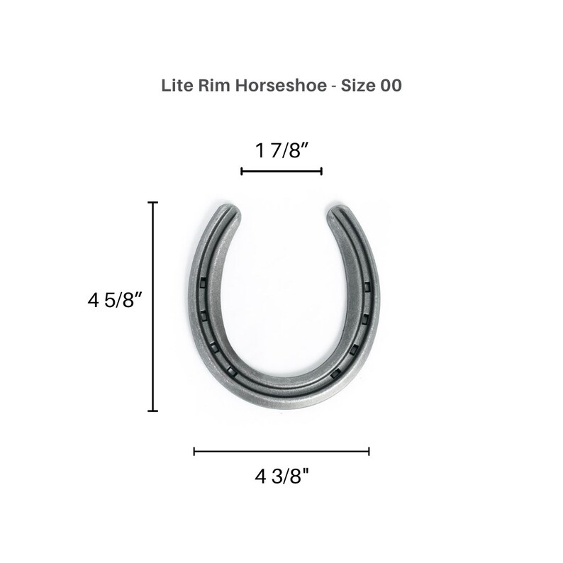 May include: A silver-colored Lite Rim Horseshoe, size 00, with dimensions of 4 5/8 inches in height, 4 3/8 inches in width, and 1 7/8 inches across the top. The horseshoe has a U-shape with visible nail holes.