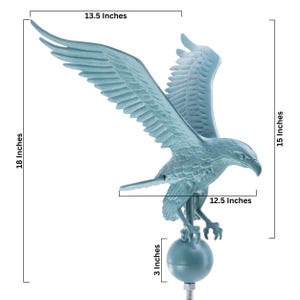 May include: A light blue eagle weather vane featuring a bird with wings spread wide, perched atop a spherical base. The structure measures 18 inches in total height, 15 inches in vertical span, 13.5 inches in wing width, 12.5 inches in length, and 3 inches for the base.