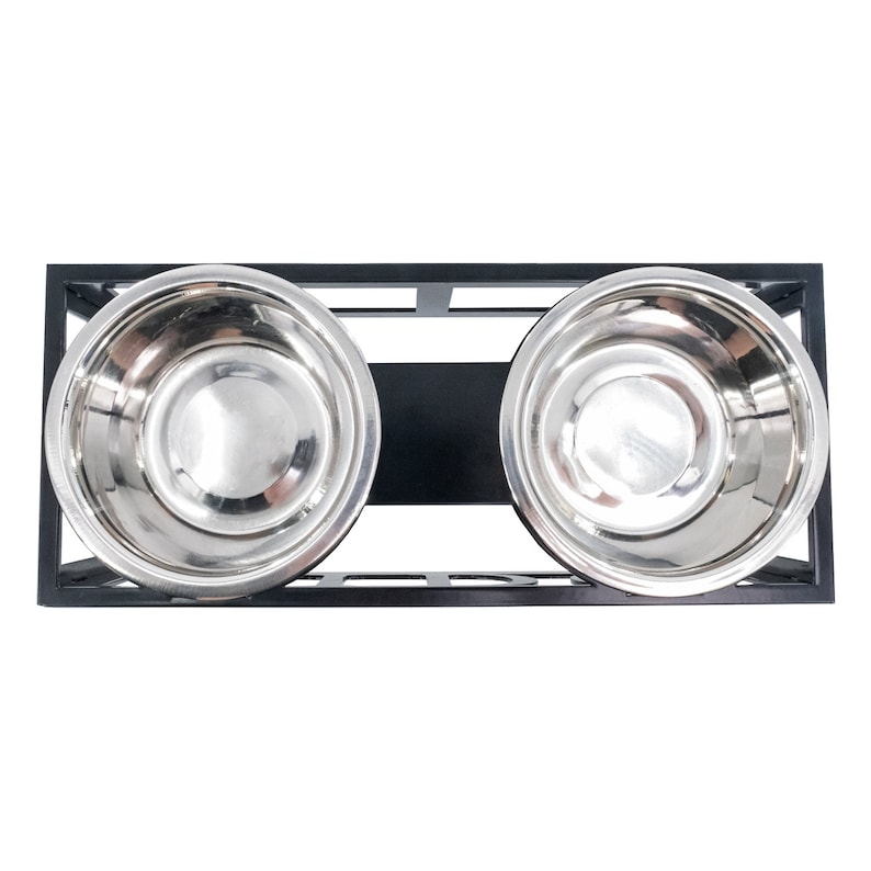 May include: Black metal elevated pet food and water bowl stand with two stainless steel bowls.