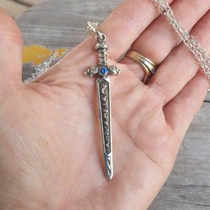 sword pendant,sterling silver pendant,beautifully  detailed with lions heads,medieval long pendant.
