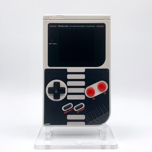 NES Theme Original Game Boy With Backlight Rainbow IPS V3 LCD Screen With 8 Color Modes & Brightness Adjustment. New exterior shell buttons and glass screen.  Protective case and surprise game included as free gifts.
