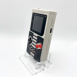 NES Theme Original Game Boy With Backlight Rainbow IPS V3 LCD Screen With 8 Color Modes & Brightness Adjustment. New exterior shell buttons and glass screen.  Protective case and surprise game included as free gifts.