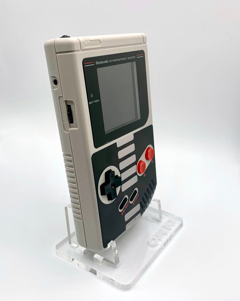 NES Theme Original Game Boy With Backlight Rainbow IPS V3 LCD Screen With 8 Color Modes & Brightness Adjustment. New exterior shell buttons and glass screen.  Protective case and surprise game included as free gifts.