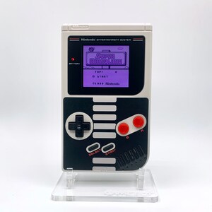NES Theme Original Game Boy With Backlight Rainbow IPS V3 LCD Screen With 8 Color Modes & Brightness Adjustment. New exterior shell buttons and glass screen.  Protective case and surprise game included as free gifts.