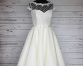 Ivory polka dot and tulle tea length 50s style wedding dress, with capped sleeves, floral trim and bow belt, made to order in UK sizes 6-24