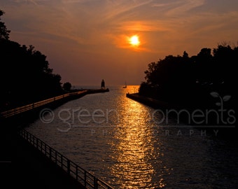 Golden sunset photograph of Charlevoix lighthouse channel